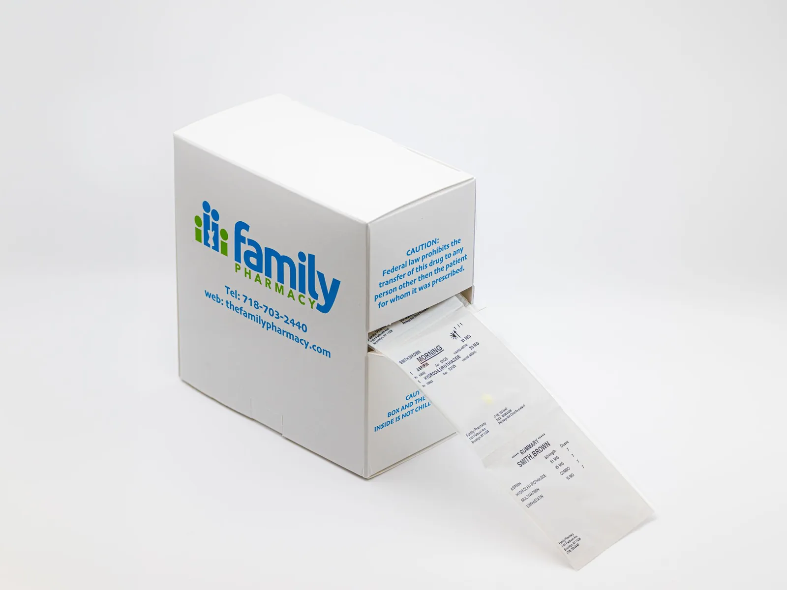Family Pharmacy multi-dose dispenser box with a strip of labeled medication pouches feeding out