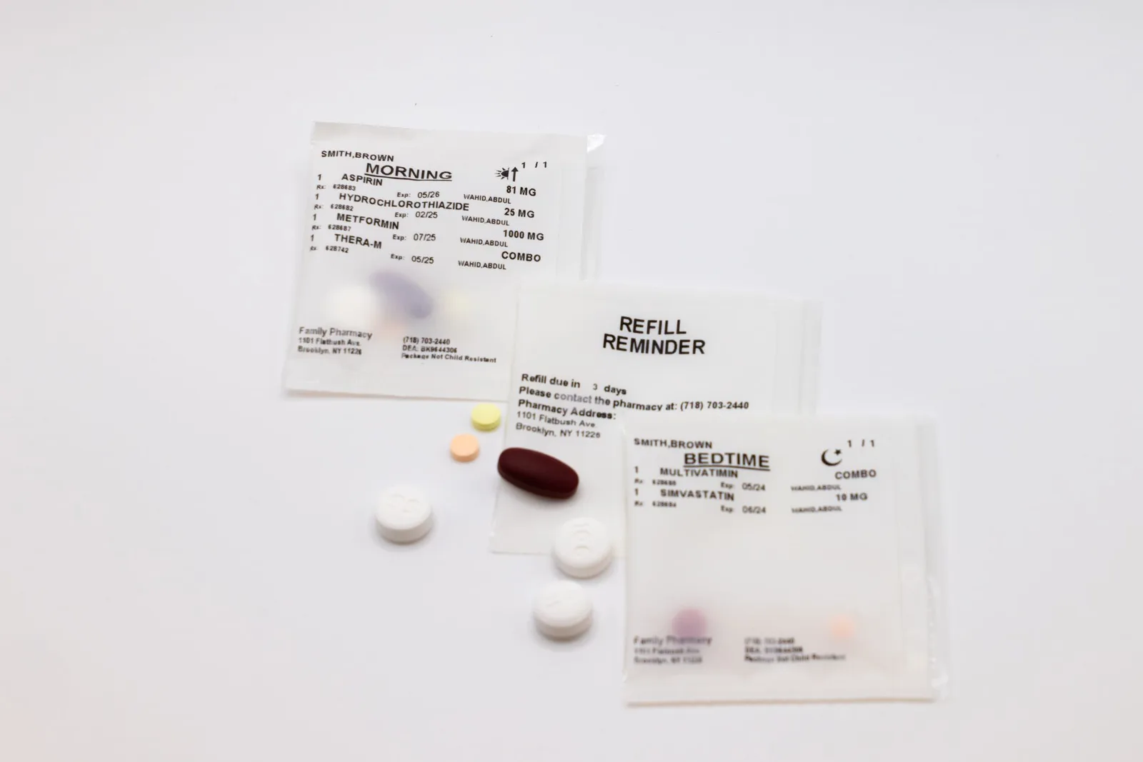 Strip of multi-dose pouches labeled Morning, Refill Reminder, and Bedtime with assorted pills
